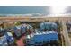 Aerial view of colorful beachfront townhomes and the surrounding community near the ocean at 3000 Ocean Shore Blvd # 18, Ormond Beach, FL 32176