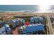 Aerial view of beach homes, oceanfront property, and outdoor pool with ocean view at 3000 Ocean Shore Blvd # 18, Ormond Beach, FL 32176