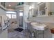 Bright bathroom featuring a double sink vanity, a soaking tub and a shower at 3000 Ocean Shore Blvd # 18, Ormond Beach, FL 32176