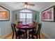Cozy dining room with a round table and comfortable seating at 3000 Ocean Shore Blvd # 18, Ormond Beach, FL 32176