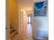 Inviting hallway with tile flooring and decorative beach-themed artwork enhancing the coastal ambiance at 3000 Ocean Shore Blvd # 18, Ormond Beach, FL 32176