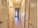 Hallway with tile flooring and ample closet space at 3000 Ocean Shore Blvd # 18, Ormond Beach, FL 32176