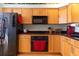 Bright kitchen with matching appliances and wood cabinets at 3000 Ocean Shore Blvd # 18, Ormond Beach, FL 32176