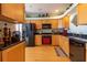 Cozy kitchen with wood cabinets and modern appliances at 3000 Ocean Shore Blvd # 18, Ormond Beach, FL 32176