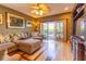 Spacious living room with hardwood floors and sliding glass doors, that provide natural light at 3000 Ocean Shore Blvd # 18, Ormond Beach, FL 32176