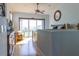 Sunny primary bedroom with a ceiling fan and ocean views from the balcony at 3000 Ocean Shore Blvd # 18, Ormond Beach, FL 32176