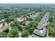 Aerial view of a property within a lush, tree-filled community, highlighting the neighborhood's landscape at 3132 Connemara Dr, Ormond Beach, FL 32174