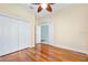 Bedroom with hardwood floors, closet, and doorway to another room at 3132 Connemara Dr, Ormond Beach, FL 32174