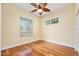 Comfortable bedroom with hardwood floors and plenty of natural light from two windows at 3132 Connemara Dr, Ormond Beach, FL 32174
