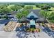 Exterior aerial view of the clubhouse entrance with manicured landscaping and inviting entryway at 3132 Connemara Dr, Ormond Beach, FL 32174