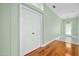 Inviting foyer with beautiful hardwood floors, closet and chandelier at 3132 Connemara Dr, Ormond Beach, FL 32174