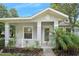 Charming front porch with white railings, offering a cozy outdoor space at 3132 Connemara Dr, Ormond Beach, FL 32174