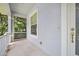 Covered front porch offers a shaded entrance with a view of the landscaped yard at 3132 Connemara Dr, Ormond Beach, FL 32174