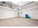 Functional garage space with overhead storage, water heater, and ample room for parking and storage needs at 3132 Connemara Dr, Ormond Beach, FL 32174