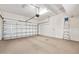 Spacious garage featuring a large door, ample room for parking, and a clean interior space for storage and projects at 3132 Connemara Dr, Ormond Beach, FL 32174