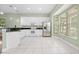 Bright kitchen featuring stainless steel appliances, tile floor, and natural lighting at 3132 Connemara Dr, Ormond Beach, FL 32174