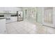 Bright kitchen featuring tile floor, stainless steel appliances, and lots of windows at 3132 Connemara Dr, Ormond Beach, FL 32174