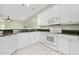 Well-lit kitchen features stainless steel appliances, granite countertops and tile flooring at 3132 Connemara Dr, Ormond Beach, FL 32174