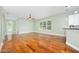 Spacious living room with beautiful hardwood floors and an open layout with great natural light at 3132 Connemara Dr, Ormond Beach, FL 32174