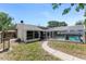The spacious backyard offers a screened pool, and ample space for outdoor activities and relaxation at 466 Leland Dr, Deltona, FL 32725
