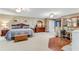Spacious bedroom with unique wallpaper, wood floors, and plenty of natural light at 466 Leland Dr, Deltona, FL 32725