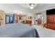 Expansive bedroom with sitting area, vanity, and arched doorway at 466 Leland Dr, Deltona, FL 32725