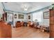 Bright bedroom with hardwood floors, charming wallpaper border, and ample desk space at 466 Leland Dr, Deltona, FL 32725
