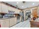 Well-equipped kitchen with stainless steel appliances and white tile flooring at 466 Leland Dr, Deltona, FL 32725