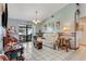 Bright living room with tile flooring, sliding glass doors to the screened patio, and neutral décor at 466 Leland Dr, Deltona, FL 32725