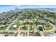 Aerial view of the neighborhood, property and the beach in the distance with red arrow to property at 1026 Bel Aire Dr, Daytona Beach, FL 32118
