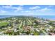 Overhead aerial view of the neighborhood showing proximity to the ocean and red arrow pointing to property at 1026 Bel Aire Dr, Daytona Beach, FL 32118