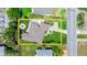 Aerial view highlighting the property and outlining the property lines with tree lined streets at 1026 Bel Aire Dr, Daytona Beach, FL 32118