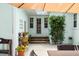 Cozy backyard entrance featuring an outdoor seating area, perfect for relaxation and enjoying the outdoors at 1026 Bel Aire Dr, Daytona Beach, FL 32118