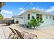 This backyard features lounge chairs and outdoor shower providing a perfect spot to relax and unwind at 1026 Bel Aire Dr, Daytona Beach, FL 32118