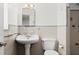 Compact bathroom featuring sink, toilet, and open shower area at 1026 Bel Aire Dr, Daytona Beach, FL 32118