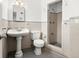 Bathroom featuring sink, toilet and open shower at 1026 Bel Aire Dr, Daytona Beach, FL 32118