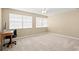 Neutral bedroom with ceiling fan, dual windows and carpet at 1026 Bel Aire Dr, Daytona Beach, FL 32118