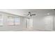 Spacious bedroom with carpet, two windows, ceiling fan and ensuite bathroom at 1026 Bel Aire Dr, Daytona Beach, FL 32118
