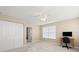 Bright bedroom featuring neutral walls, plush carpet and ceiling fan with window views at 1026 Bel Aire Dr, Daytona Beach, FL 32118