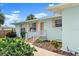 Charming light blue single story home featuring a landscaped front yard and inviting entrance at 1026 Bel Aire Dr, Daytona Beach, FL 32118