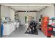 Tidy garage features a motorcycle, laundry, and abundant storage at 1026 Bel Aire Dr, Daytona Beach, FL 32118