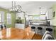 Eat-in kitchen featuring a breakfast bar, modern appliances, and white cabinetry at 1026 Bel Aire Dr, Daytona Beach, FL 32118