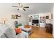 Warm and inviting living room with stylish decor, hardwood floors, and ample seating at 1026 Bel Aire Dr, Daytona Beach, FL 32118