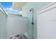 Enclosed outdoor shower with stone flooring is conveniently located outside of the home at 1026 Bel Aire Dr, Daytona Beach, FL 32118
