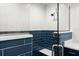 Modern shower with herringbone tile and glass enclosure and quartz seat at 1026 Bel Aire Dr, Daytona Beach, FL 32118