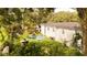Backyard featuring some greenery, a pool, and a partially fenced-in yard at 1131 Martha Dr, Daytona Beach, FL 32114