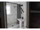 Bathroom with tile surround, shower stall and pedestal sink at 1131 Martha Dr, Daytona Beach, FL 32114