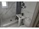 Modern bathroom with tiled shower and unique design accents surrounding the sink area at 1131 Martha Dr, Daytona Beach, FL 32114