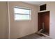Bright bedroom featuring a window and an open closet space, perfect for customization at 1131 Martha Dr, Daytona Beach, FL 32114