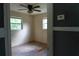 Inviting bedroom with ceiling fan, two windows, and great natural light at 1131 Martha Dr, Daytona Beach, FL 32114
